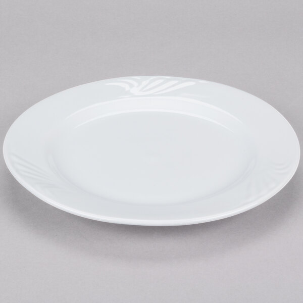 A CAC Roosevelt porcelain plate with a fork on it.