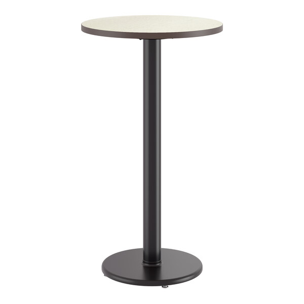 A round bar height table with a reversible birch and ash laminated top and a black cast iron base.