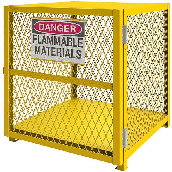A yellow Durham Manufacturing vertical gas cylinder cabinet with self-closing door and a sign.