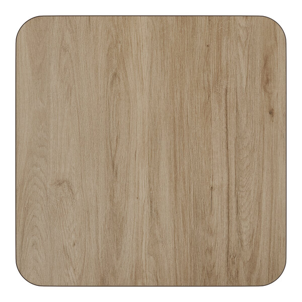 A square, reversible laminated table top in a white birch and ash finish with rounded corners, paired with a 17-inch cast iron base.