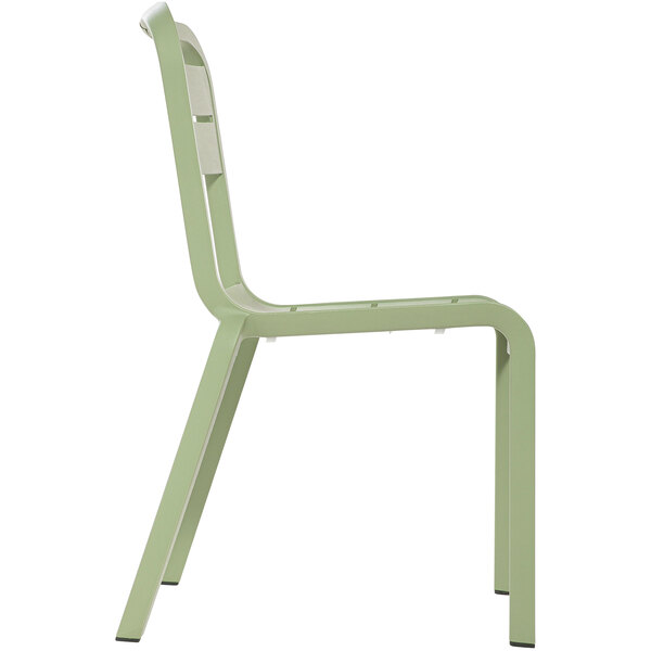 A green Grosfillex outdoor sidechair with white legs.