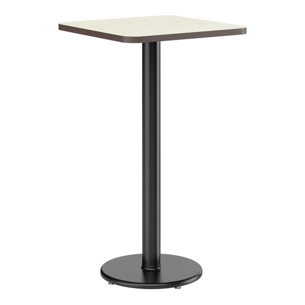 A square bar height table with a reversible white birch or ash laminated top and a black cast iron base.