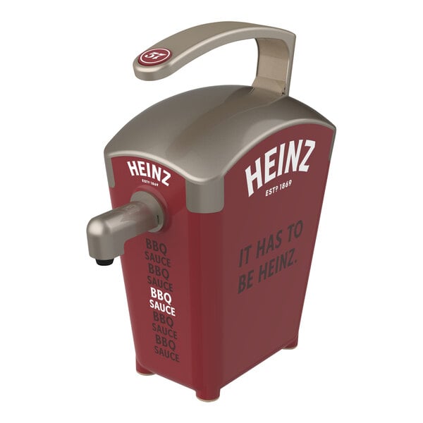 A brown plastic Heinz countertop pump dispenser with a silver and red pump.