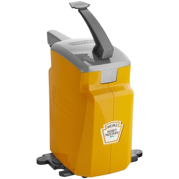 A yellow and grey Heinz countertop honey mustard pump dispenser.