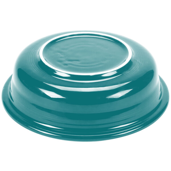 A close-up of a turquoise Fiesta extra large bowl with a white rim.