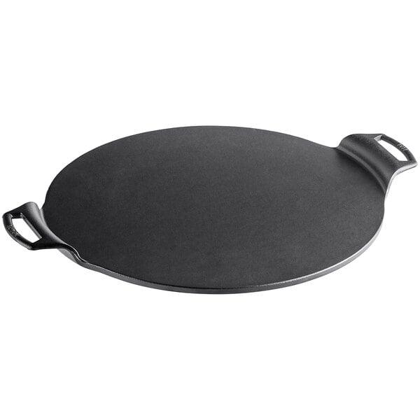 A Lodge black round pan with two handles.