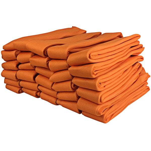 A stack of Quick Dam water barriers in orange packaging.