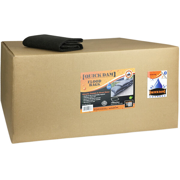 A large brown box with a black label for Quick Dam flood bags.