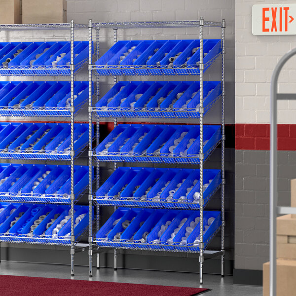 A Regency stationary chrome shelving unit with blue bins on shelves.