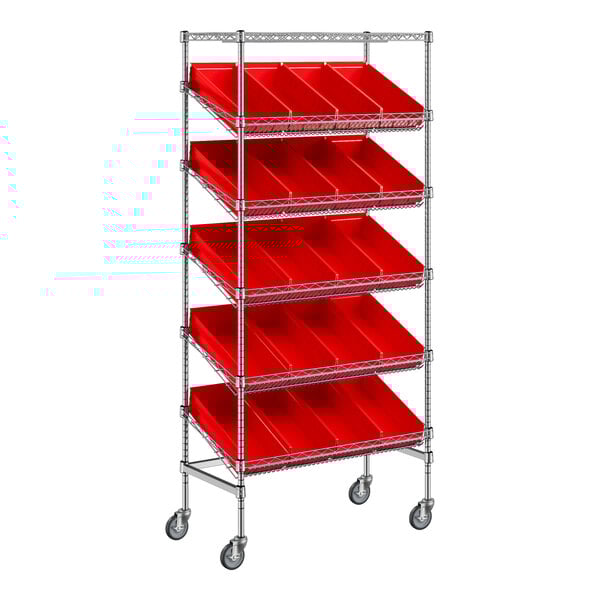 A silver metal Regency shelving unit with red slanted shelves and bins on wheels.