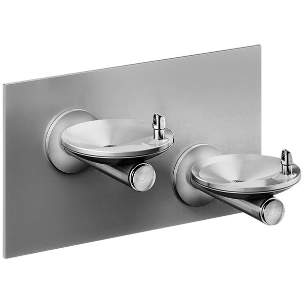 An Elkay stainless steel wall mount drinking fountain with two oval basins.