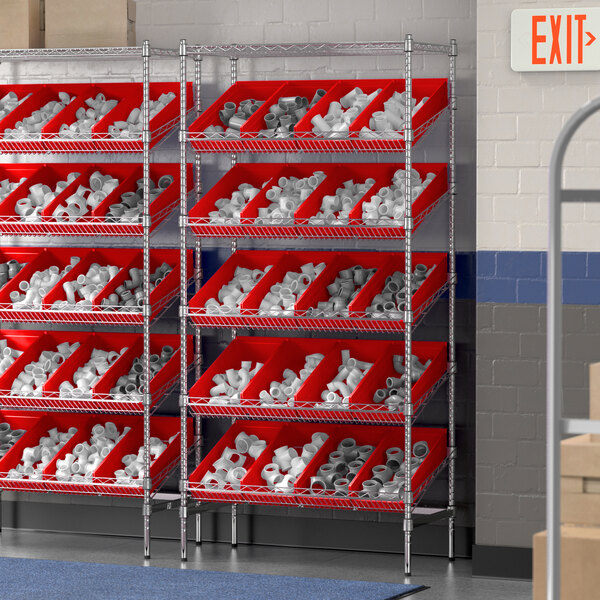 A Regency stationary chrome shelving unit with red bins on the shelves.