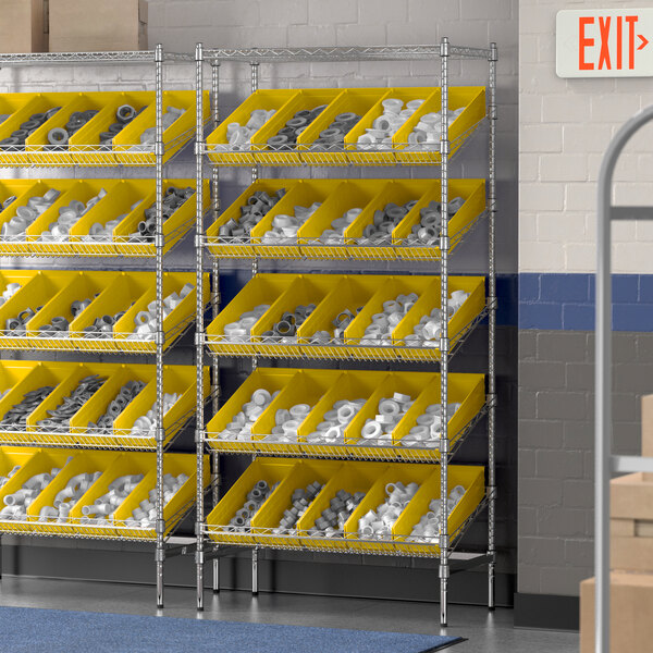 A Regency stationary slanted chrome shelf unit with yellow bins on metal shelves.