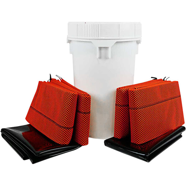 A white bucket with red and black bags on top.