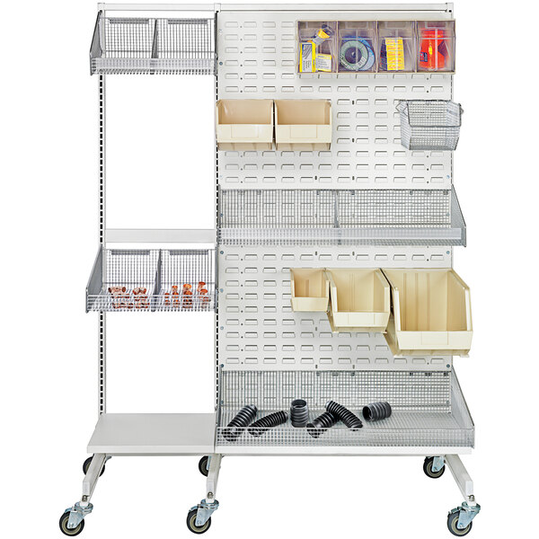 A white metal wall with Quantum chrome hanging baskets and shelves.