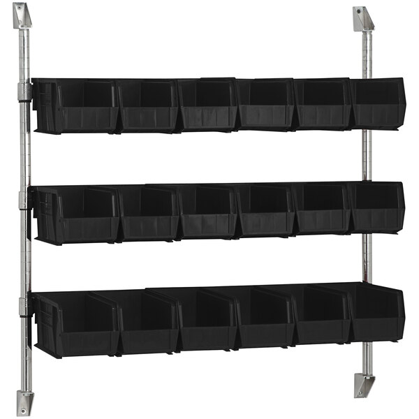 A Quantum wall mount cantilever with black divider bins on it.