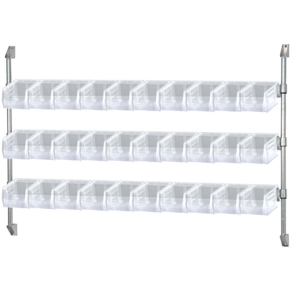 A Quantum white wall mount cantilever shelf with clear plastic bins.