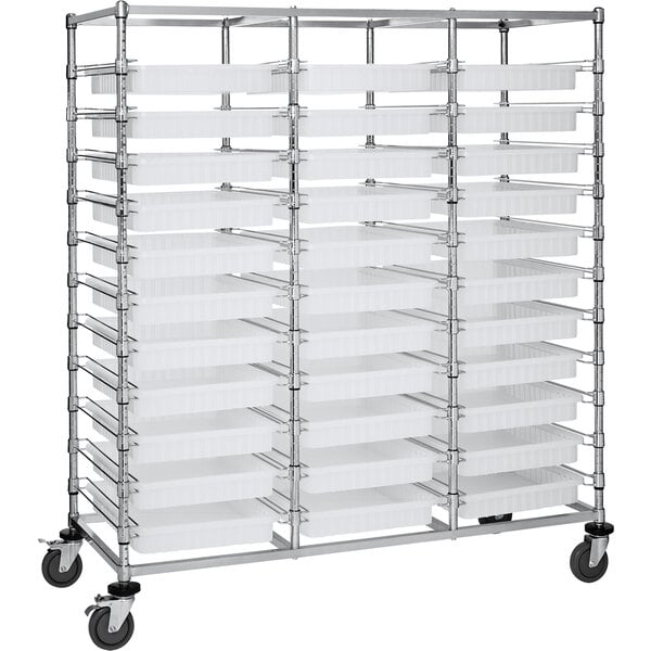 A large metal Quantum rack with 33 clear trays on wheels.