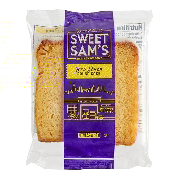 A piece of Sweet Sam's Iced Lemon Pound Cake in a yellow and purple plastic wrapper.