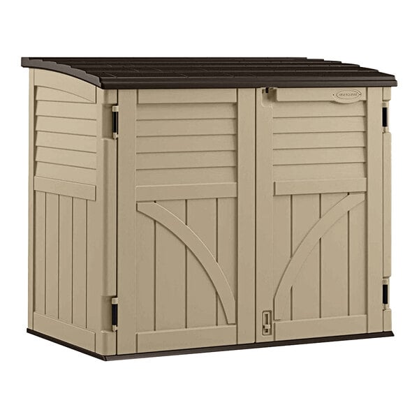 A tan outdoor storage shed with brown trim.