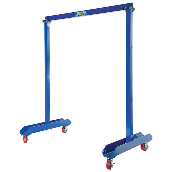 A blue metal Vestil portable work area gantry crane frame with red wheels.