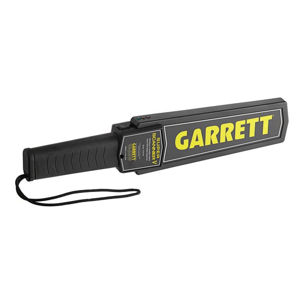 A Garrett handheld metal detector with a black handle and yellow rectangular device with the word "Garrett" in yellow.