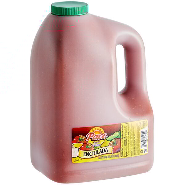 A white jug of Pace Enchilada Sauce filled with red sauce and vegetables.