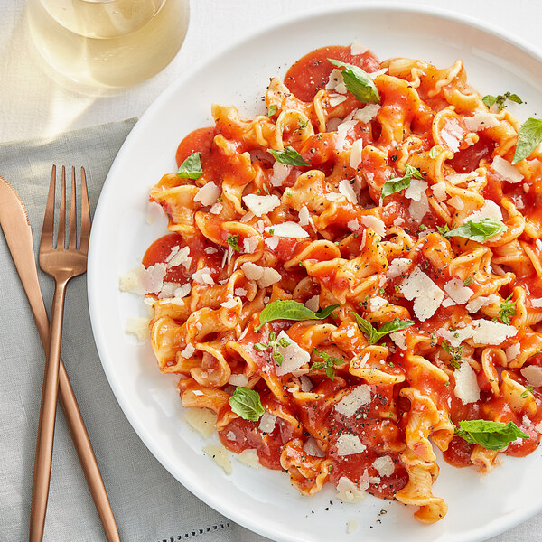 A plate of pasta with Prego No Salt Added Pasta Sauce and cheese on top.