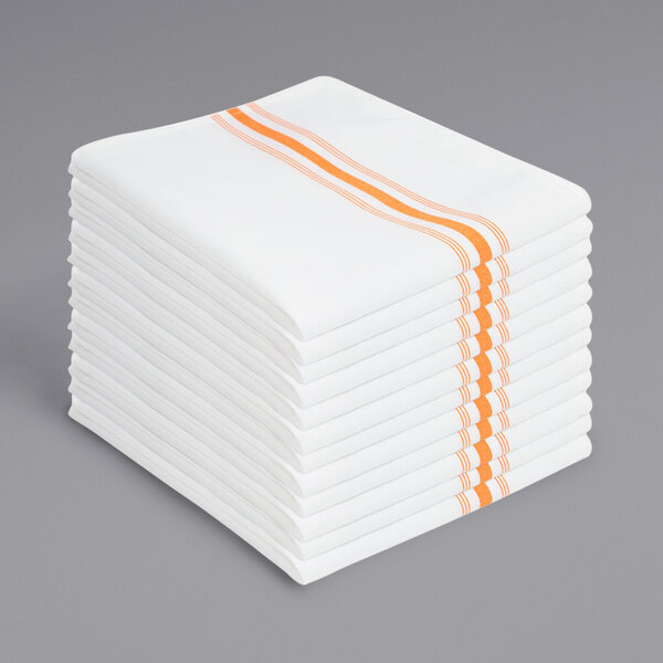 A stack of white Monarch Brands cloth napkins with orange stripes.