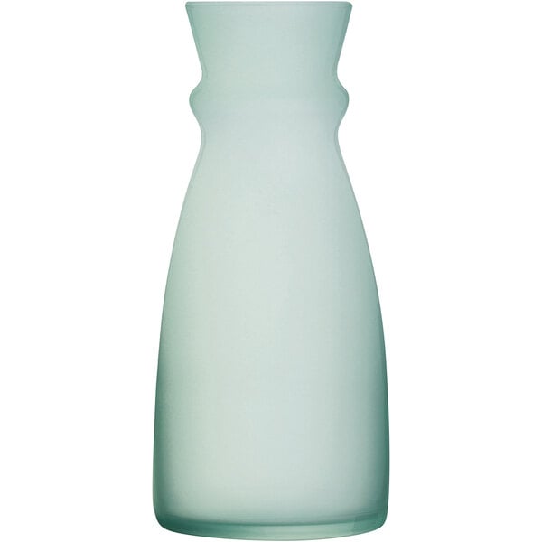 An Arcoroc clear glass carafe with a white background.