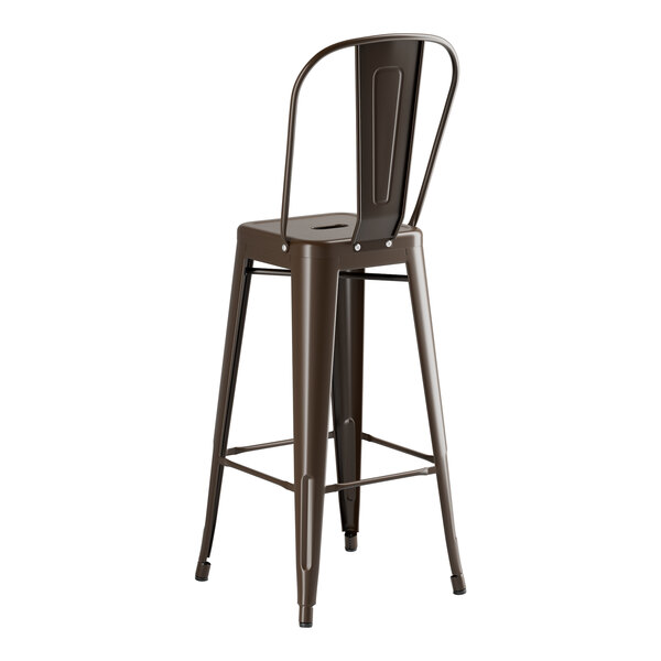 A brown metal bar stool with a backrest on a copper table.