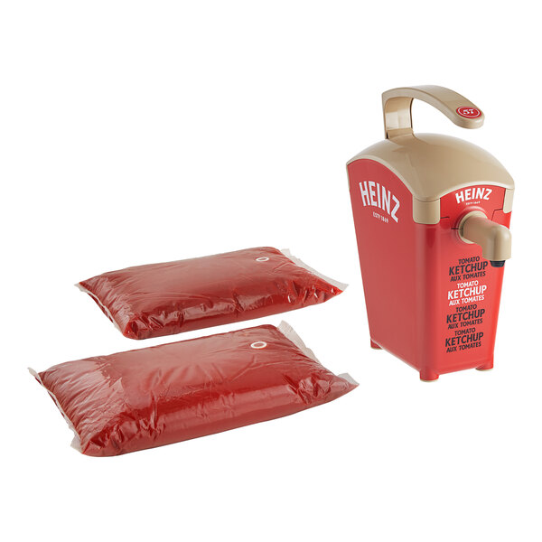 A red plastic Heinz ketchup dispenser with two ketchup pouches.