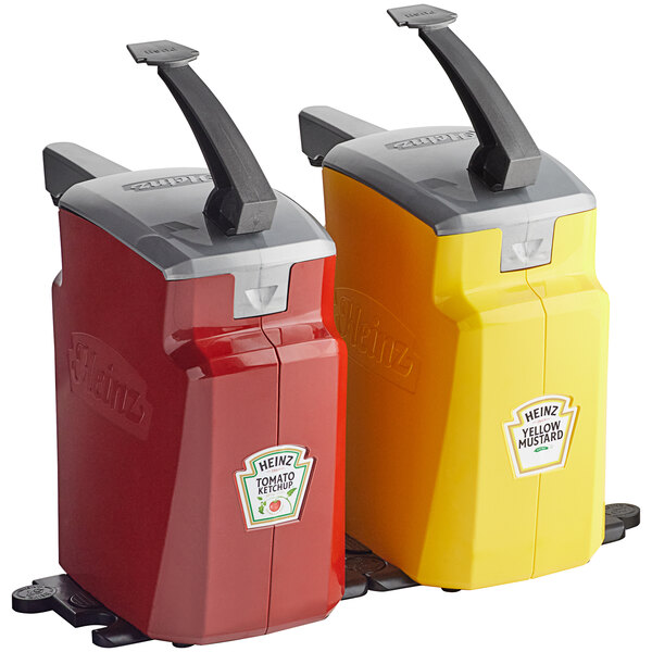 Two red and yellow Heinz pump condiment dispensers with black handles.