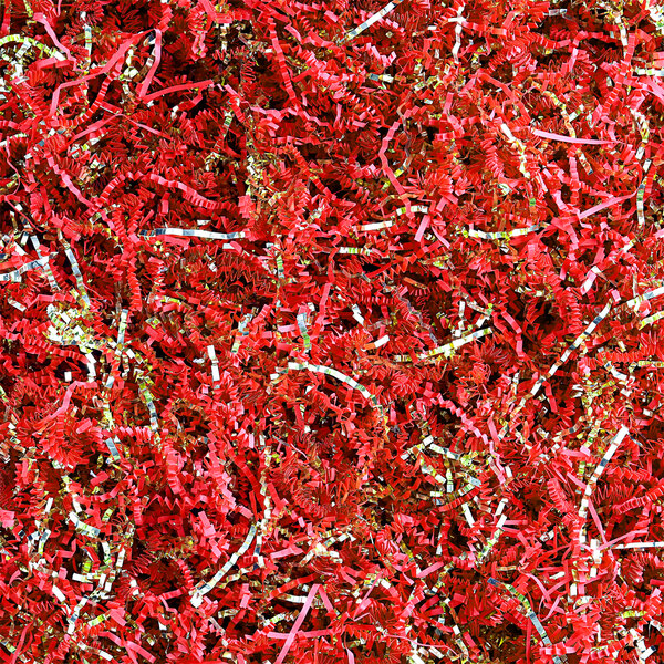 A pile of red and gold Spring-Fill crinkle cut paper.