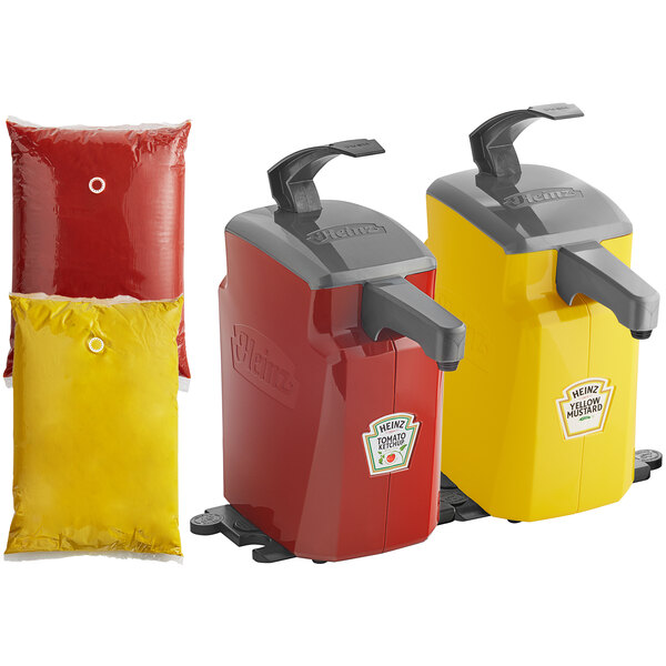 Two red and yellow Heinz countertop pump dispensers with yellow and red Heinz pouches.