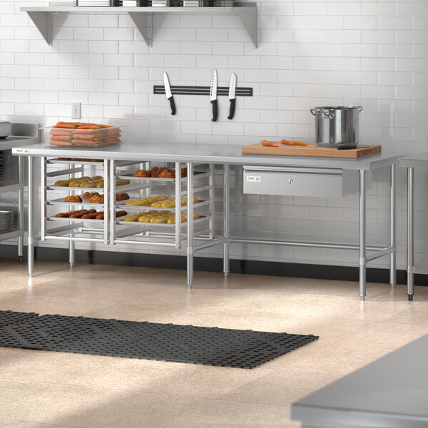 A Regency stainless steel open base work table in a kitchen.