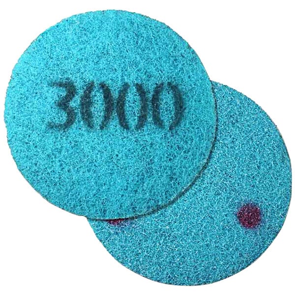 An Onfloor 8" blue circular poly pad with 3000 grit.