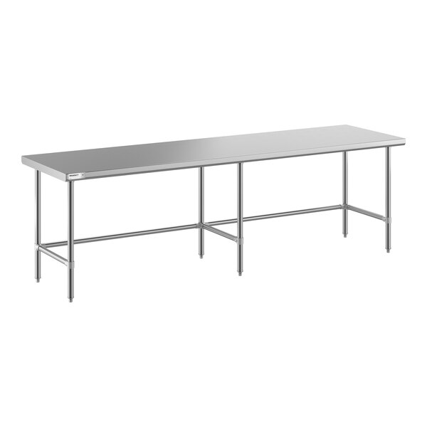 A long, rectangular stainless steel table with an open base and six supporting legs.