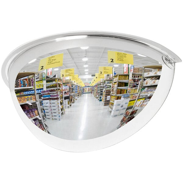 A See All Industries 180 degree security mirror reflecting a grocery store aisle.