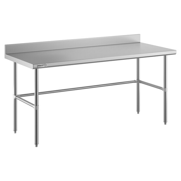 A Regency stainless steel work table with a long white top and metal legs.