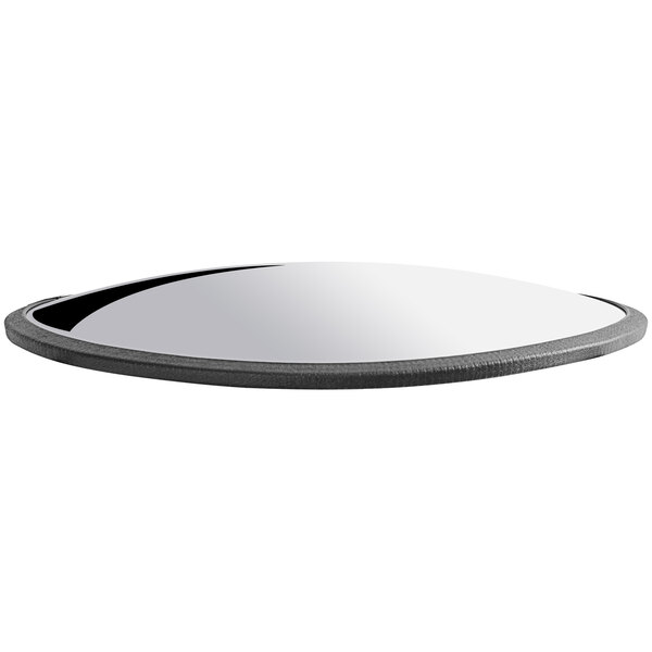 A round convex plastic security mirror with a black border.