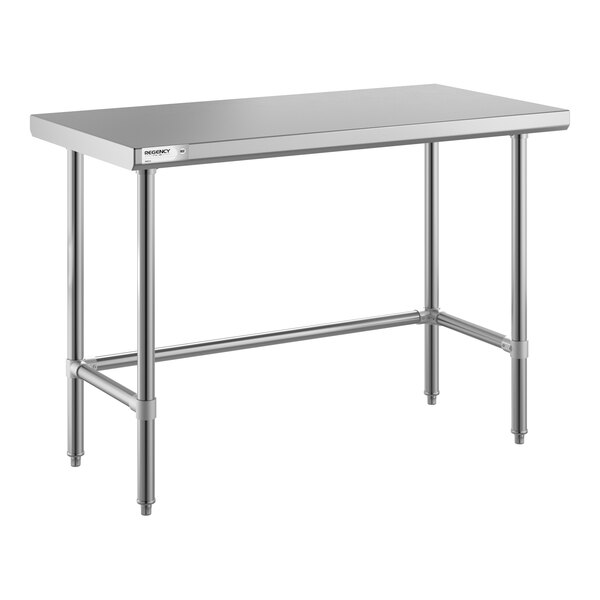 A stainless steel table with an open base and four legs, featuring a flat rectangular top and support bars connecting the legs.