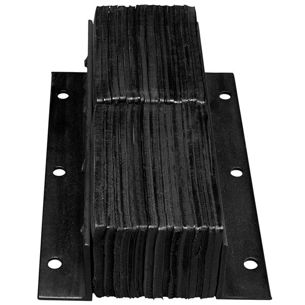 A stack of black metal Ideal Warehouse dock bumper plates with holes in them.