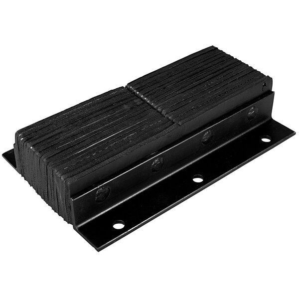 A black metal plate with two holes on a stack of black metal plates.