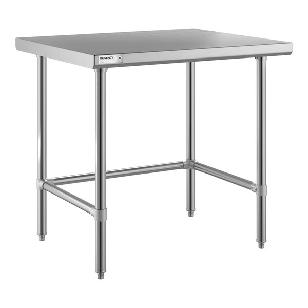 A metal table with a flat rectangular top, four cylindrical legs, and horizontal support bars connecting the legs near the base.