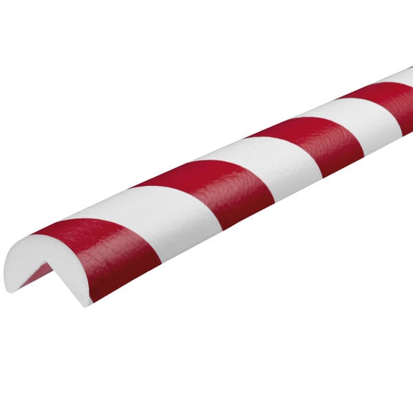 A red and white striped Ideal Warehouse corner guard.