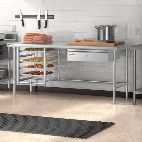 A Regency stainless steel open base work table in a kitchen.