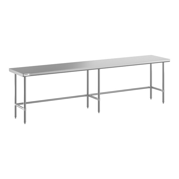 A long, rectangular stainless steel table with an open base and metal legs.