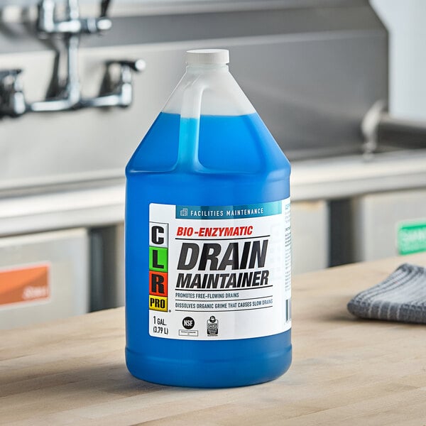 A blue CLR Pro Bio-Enzymatic Drain Maintainer container with a white label on a counter.