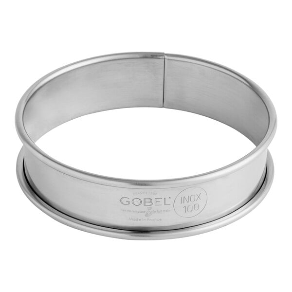 A Gobel stainless steel round deep tart ring with a circular edge.